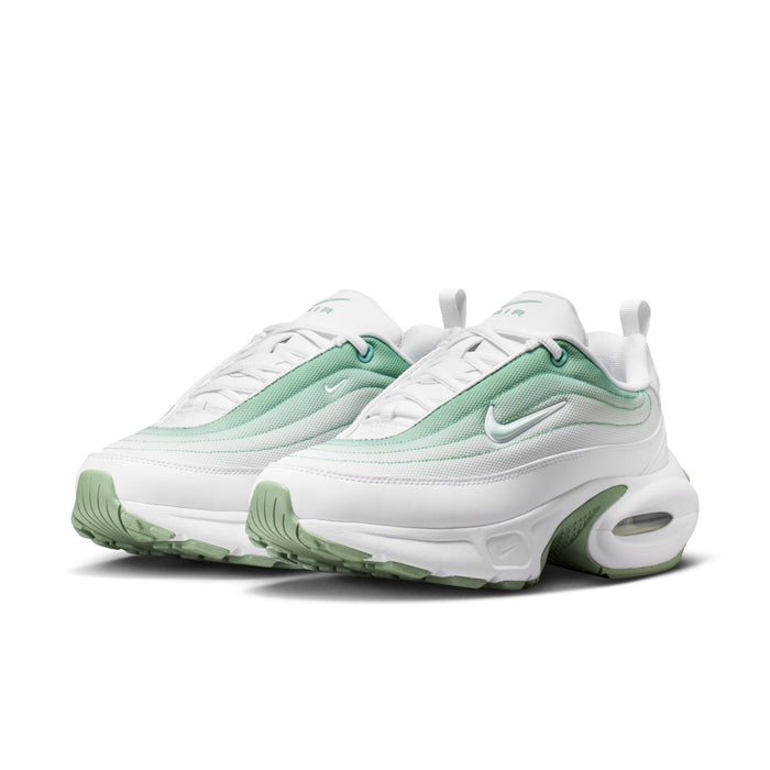 White and mint green women's running sneaker with visible Air cushioning unit