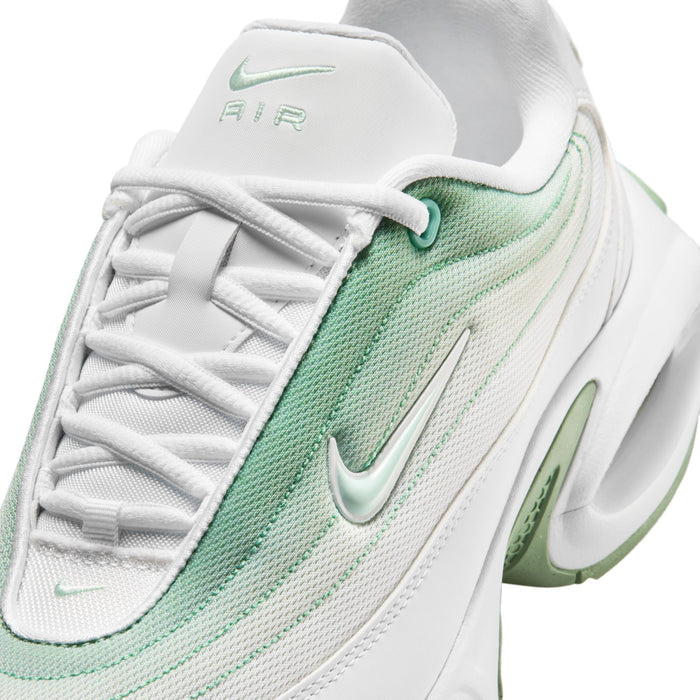 White women's sneaker close-up of lace-up upper and Air tongue logo with mint trim