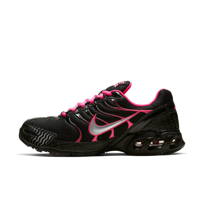 Women's black sneaker with pink laces, silver swoosh, and visible Air cushioning