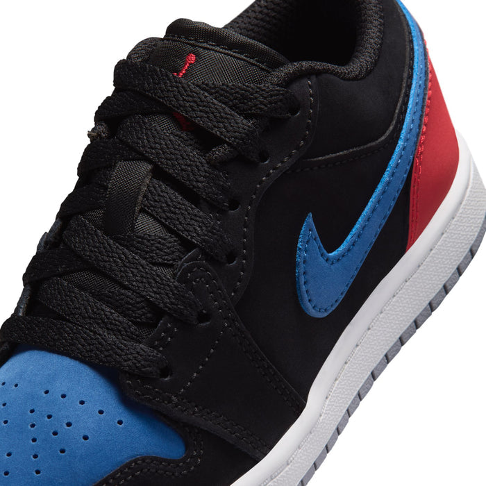 Kids low-top sneaker close-up: black laces with blue swoosh and red side stripe