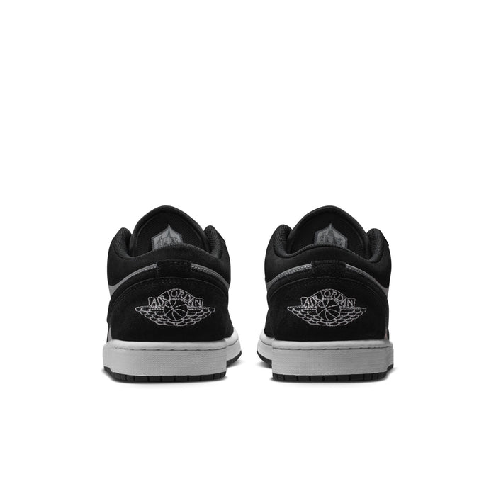 Black heel of low-top sneakers with embroidered Jumpman logo and white midsole
