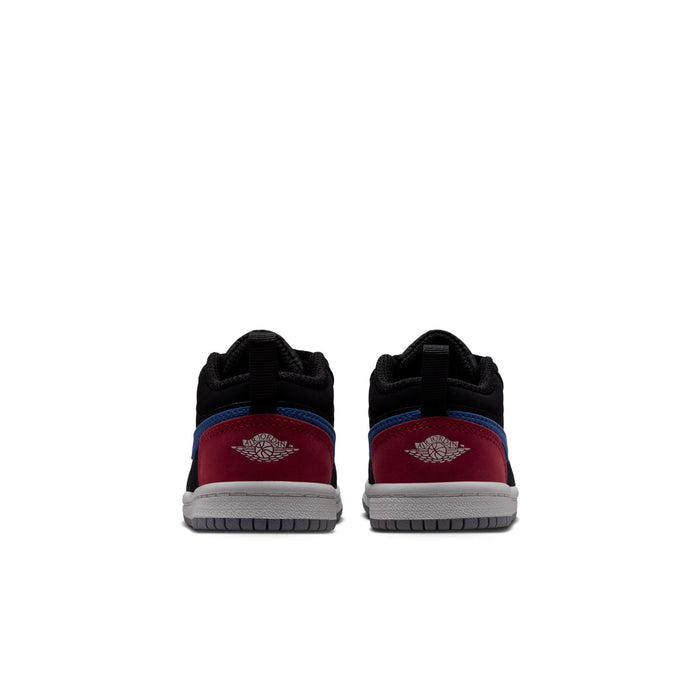 Toddler black low-top sneakers with blue heel and red heel tab, lace-up