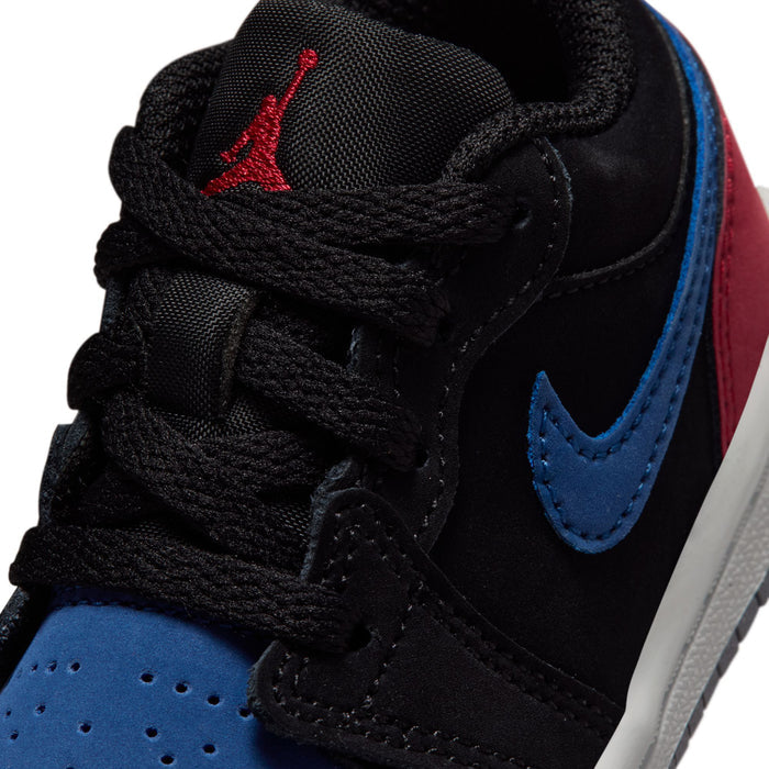 Close-up of toddler black sneaker with blue swoosh, red Jumpman, and textured upper