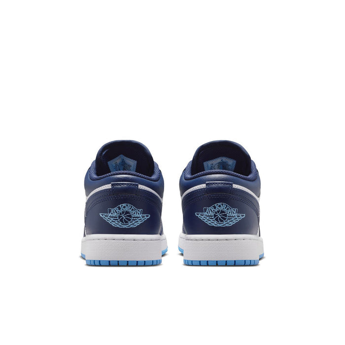 Youth low-top sneakers heel view with navy lining, white midsole, and blue outsole