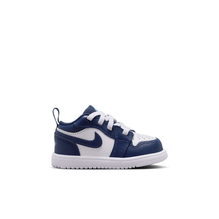 Toddler navy and white low-top sneakers with lace-up front and Nike Swoosh