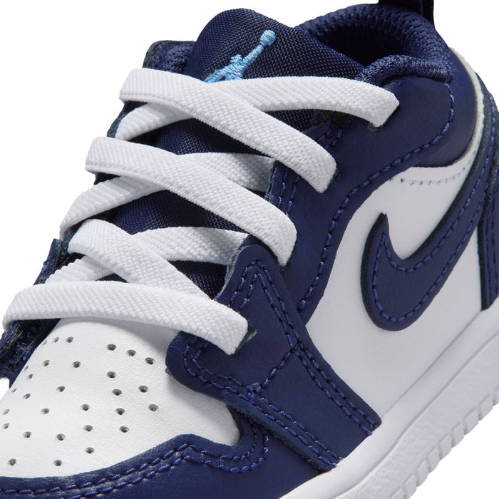 Toddler navy and white sneaker with textured upper, lace loops, and white Swoosh detail