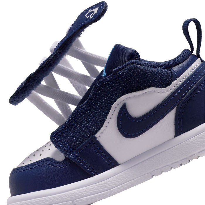 Toddler navy and white low-top sneakers with lace strap and side Swoosh