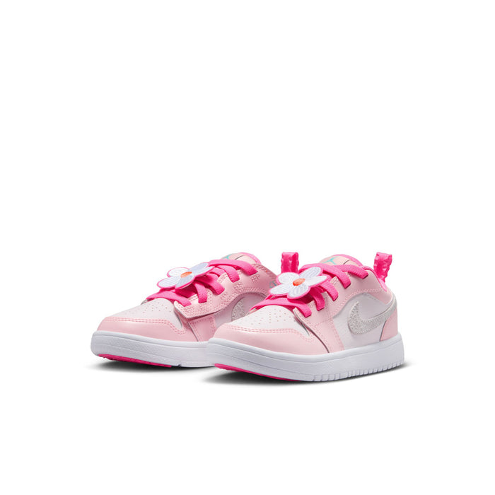 Kids' AJ 1 Low SE sneakers, pink pair with flower laces and white midsoles