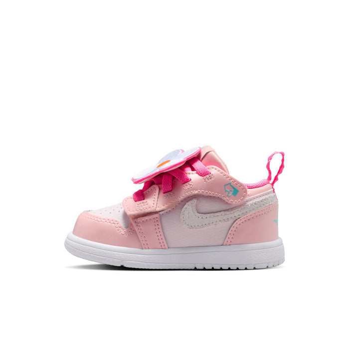Pink toddler low-top sneakers with pink hook-and-loop strap and gray Swoosh detail