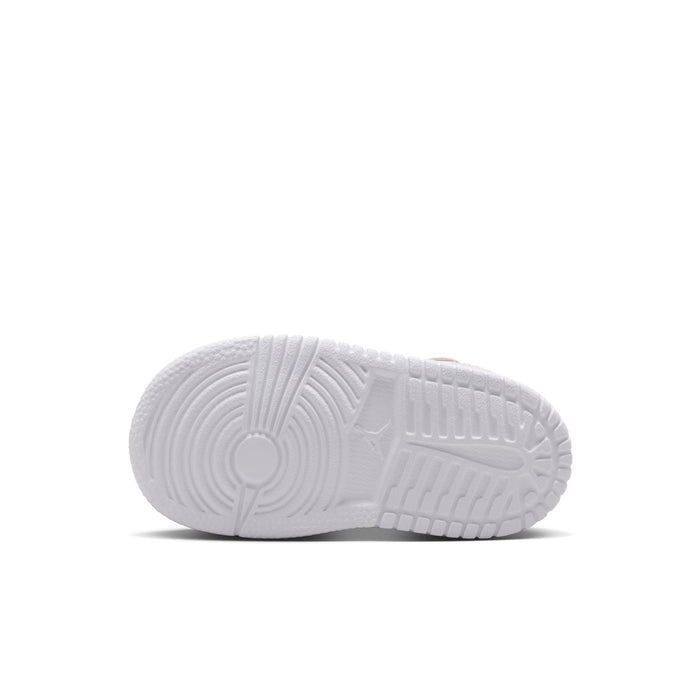 White rubber outsole of toddler low-top sneaker with tread pattern