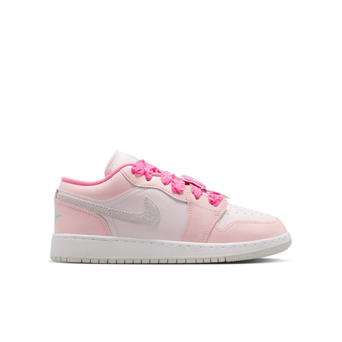 Youth low-top sneakers in pink and white with pink lace trim and side swoosh logo