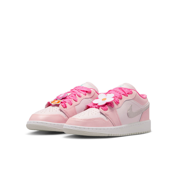 Youth low-top sneakers with pink laces and floral accents on the side