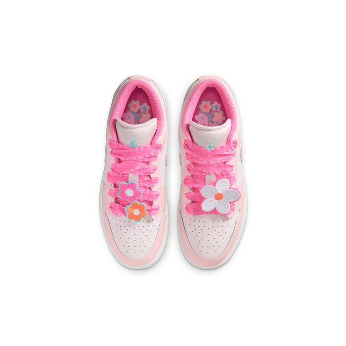 Youth sneakers pair with pink laces and flower applique on the tongue and side