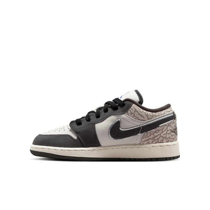 Youth Air Jordan 1 Low SE sneakers, angled side; white upper with black swoosh and laces