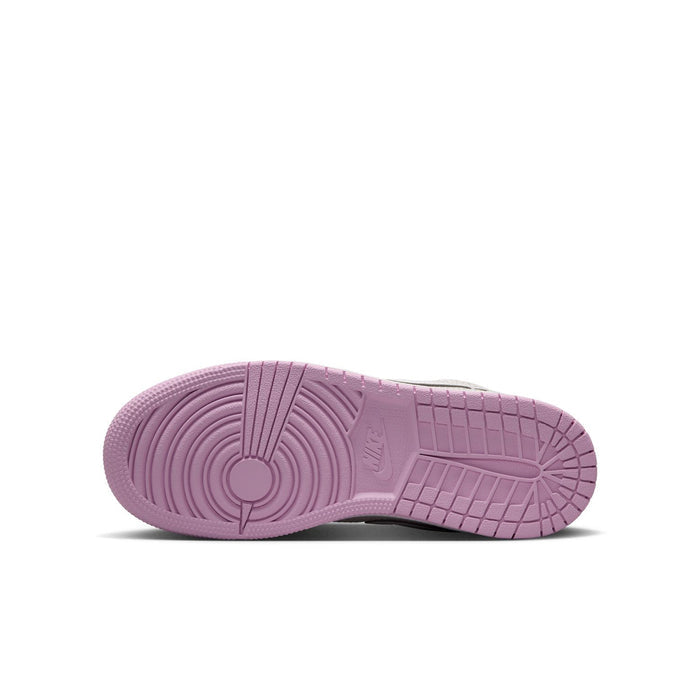 Youth sneaker outsole in light purple-pink with textured tread and circular traction lines