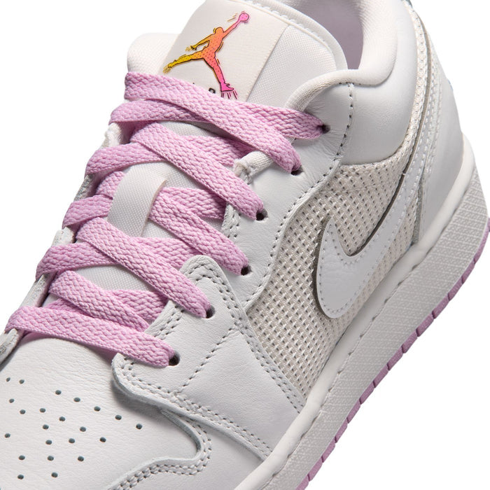 Close-up of youth sneakers: white mesh and leather with light pink laces and Jumpman tongue logo