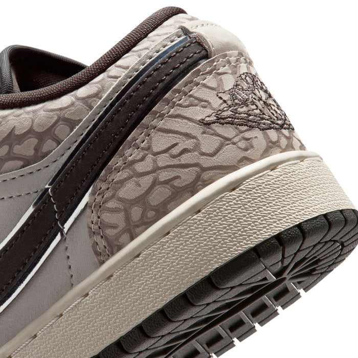 Youth Air Jordan 1 Low SE sneaker close-up; textured gray panel and black side stripe