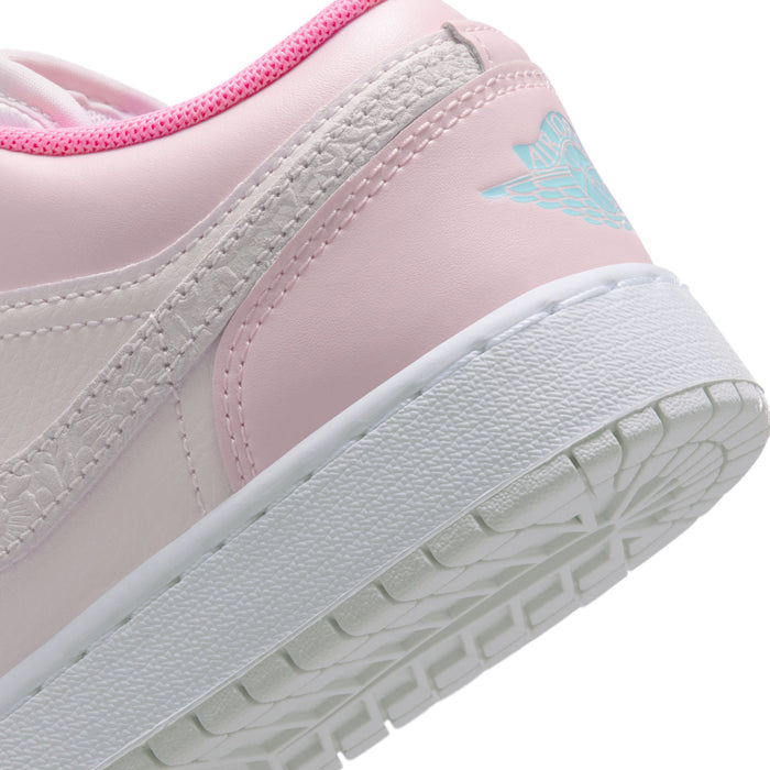 Youth sneaker close-up of side panel and sole edge with light-blue logo detail