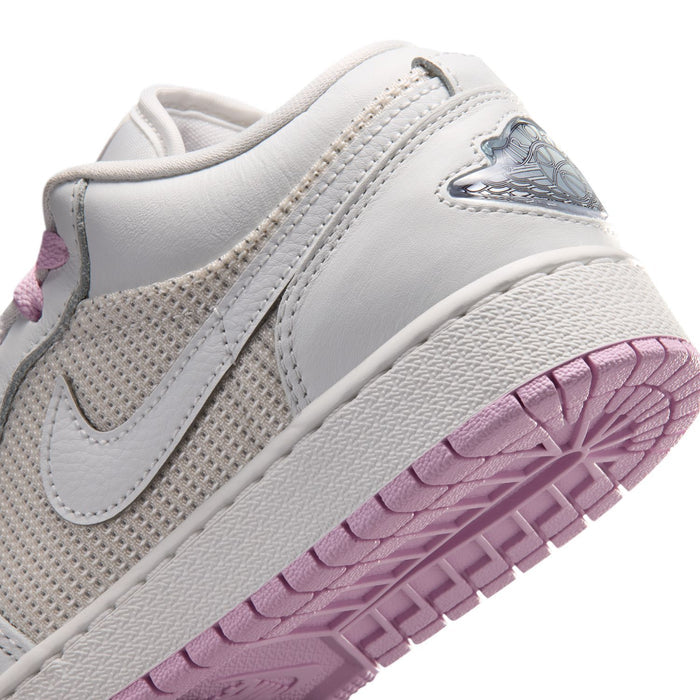 Close-up youth low-top sneaker side: white upper with Nike swoosh and light pink outsole