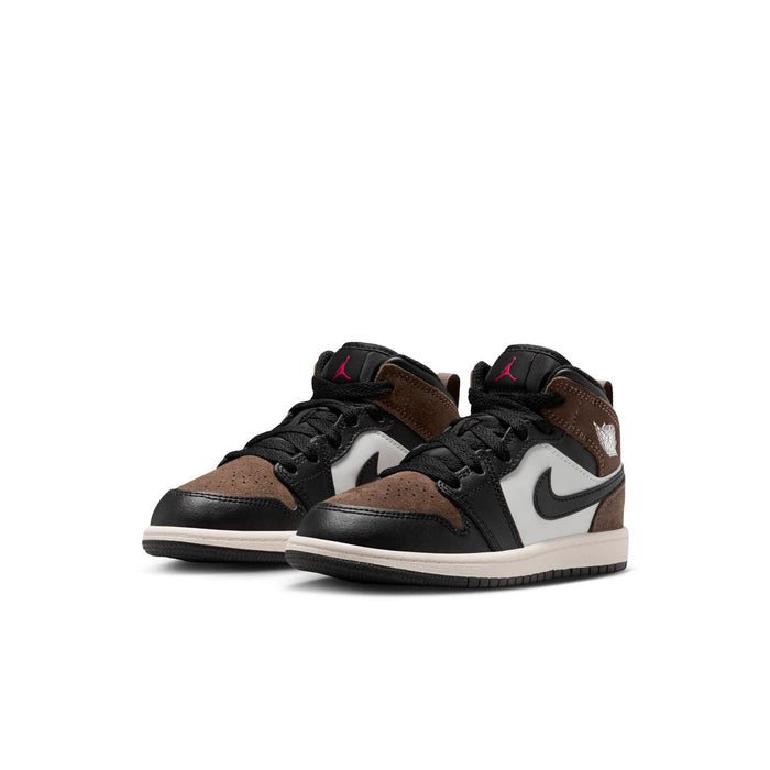 Kids mid-top sneakers, black and white with brown overlays and red Jumpman accents