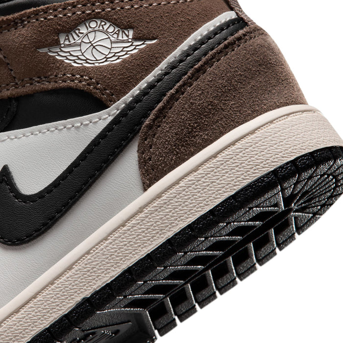 Kids mid-top sneaker close-up with AIR JORDAN wings logo on brown suede