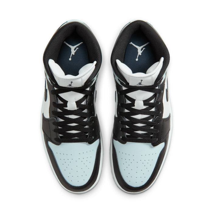 Black and light blue mid-top sneakers showing insoles with Air Jordan tongue logos