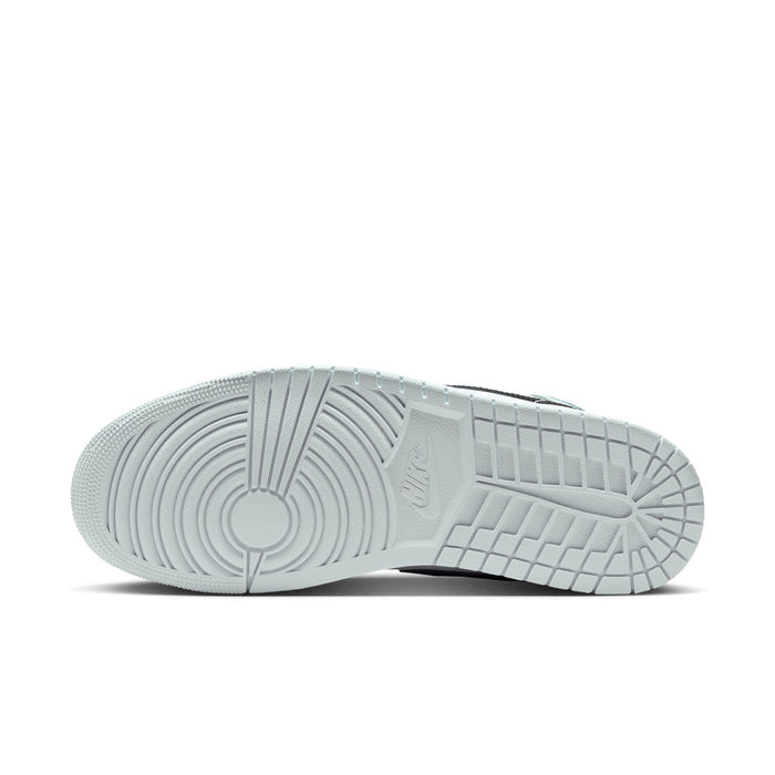 Light blue outsole of mid-top sneakers with textured tread and circular logo