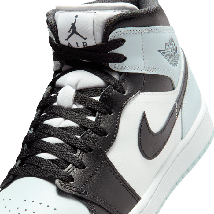 Close-up of black laces and light blue tongue on mid-top Air Jordan sneakers