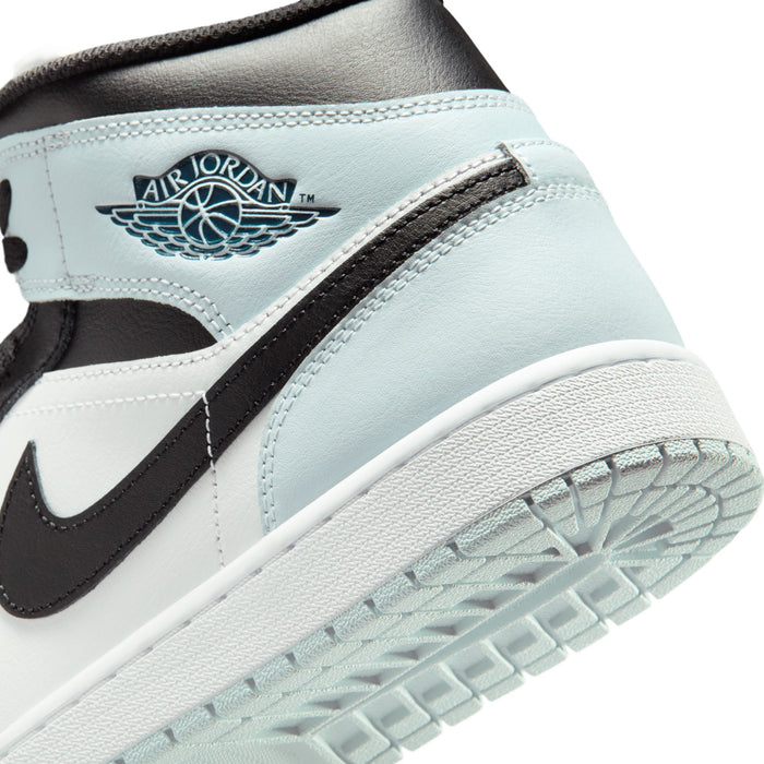 Close-up of light blue upper with Air Jordan wings and black side stripe on sneakers