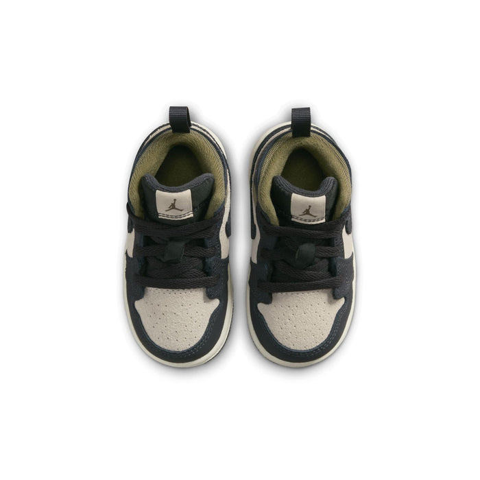 Toddler mid-top sneakers, top view of two shoes with black laces and olive lining