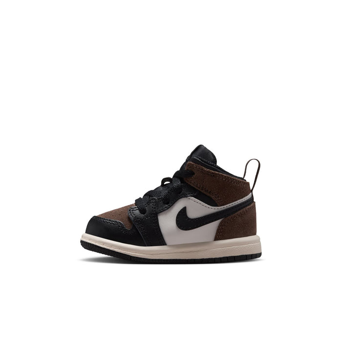 Toddler mid-top sneakers side view, black with brown collar, white Nike Swoosh