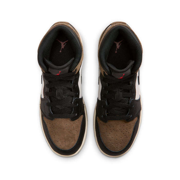 Youth sneakers showing black interior, brown suede uppers, and black lace-up closure.
