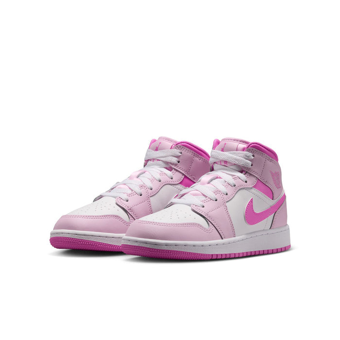 Youth lace-up sneakers with white leather, pink overlays, and side Swoosh logo