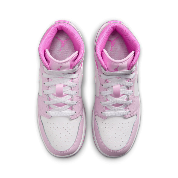 Pair of youth sneakers from above, white uppers with pink lining and lace panel