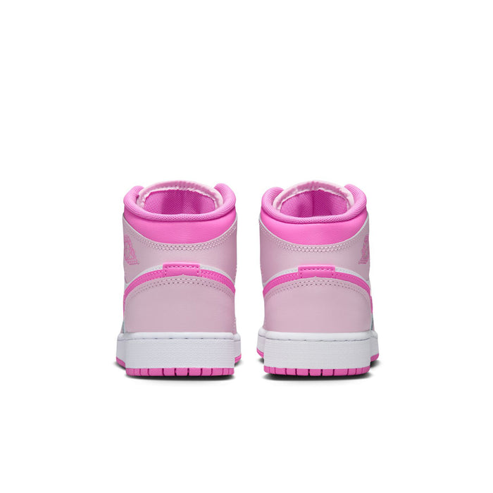 Youth mid-top sneakers with pink collars and white midsoles, back view