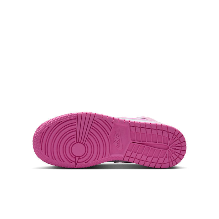 Youth sneaker outsole in pink with traction grooves under the heel and forefoot