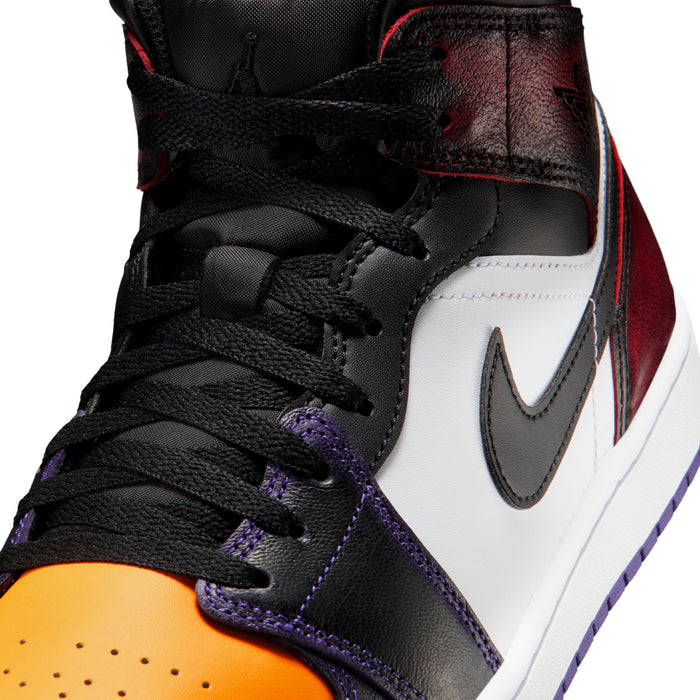 Close-up of mid-top sneakers in black with white swoosh; purple accents; orange toe