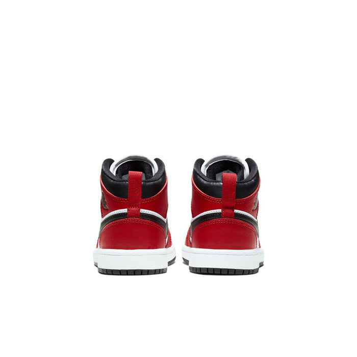 Kids mid-top sneakers with red heel panels and black collar, rear view
