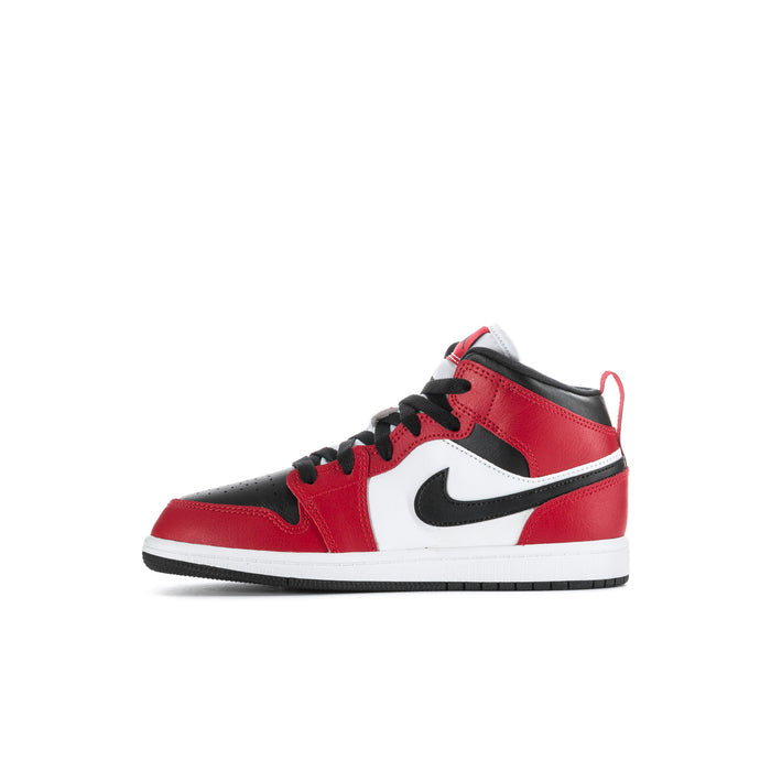 Kids mid-top sneakers in red with black collar, white panel, and black swoosh