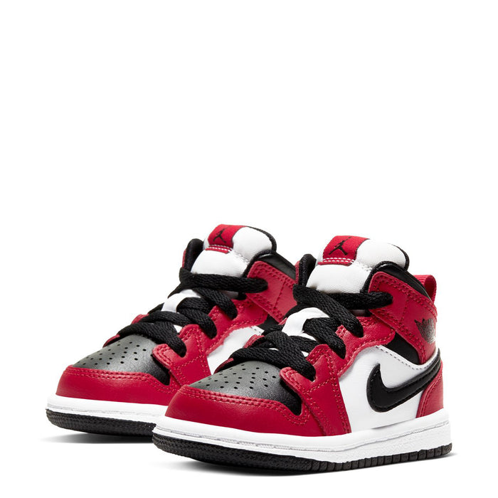 Pair of toddler mid-top sneakers with red uppers, white overlays, and black laces.