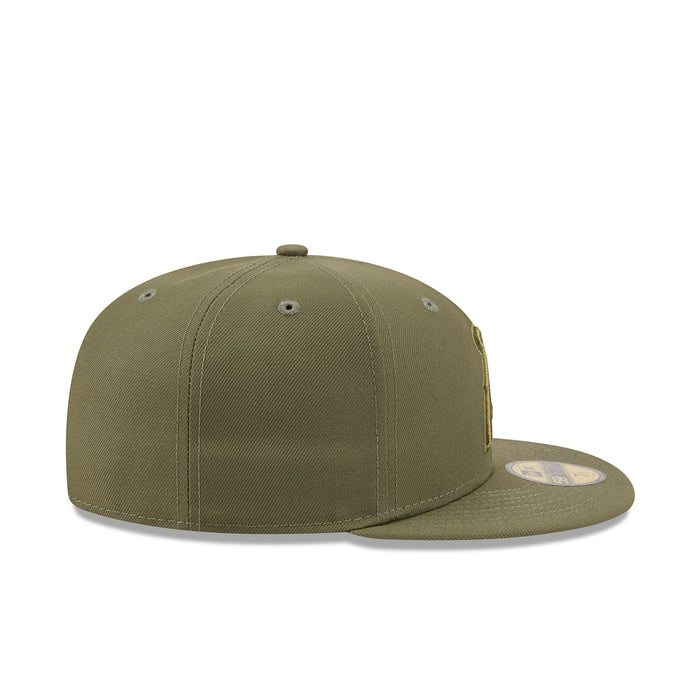 Olive baseball cap, side view with small embroidered logo patch