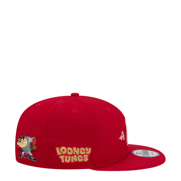 Red baseball cap with cartoon wordmark on back panel and small character emblem, snapback