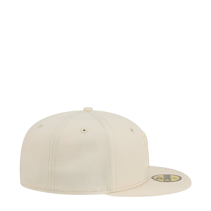 Light cream baseball cap, side view with tonal logo on crown and brim