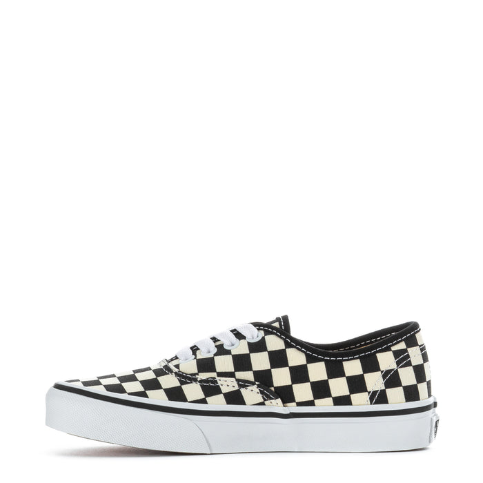 Kids low-top sneakers, side view in black and white checkerboard pattern