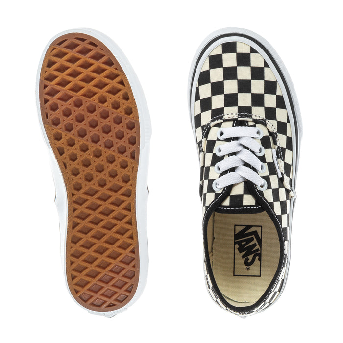 Kids low-top sneakers showing waffle outsole and checkerboard canvas upper