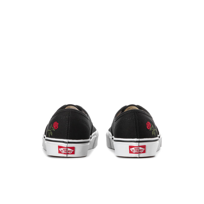 Men's black canvas sneakers rear view with rose embroidery and heel tab branding