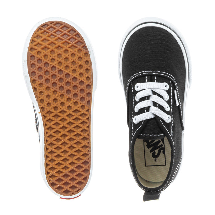 Black toddler low-top sneaker showing white outsole tread and Vans logo label