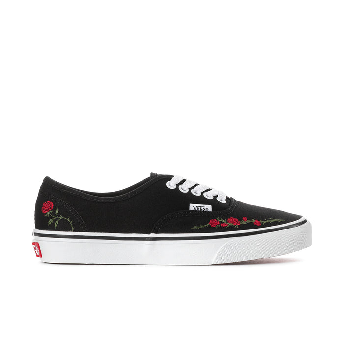Women's black low-top sneakers with embroidered red rose accents and white laces.