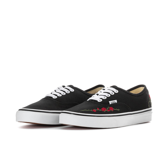 Women's black low-top sneakers with red rose embroidery and white rubber sole.