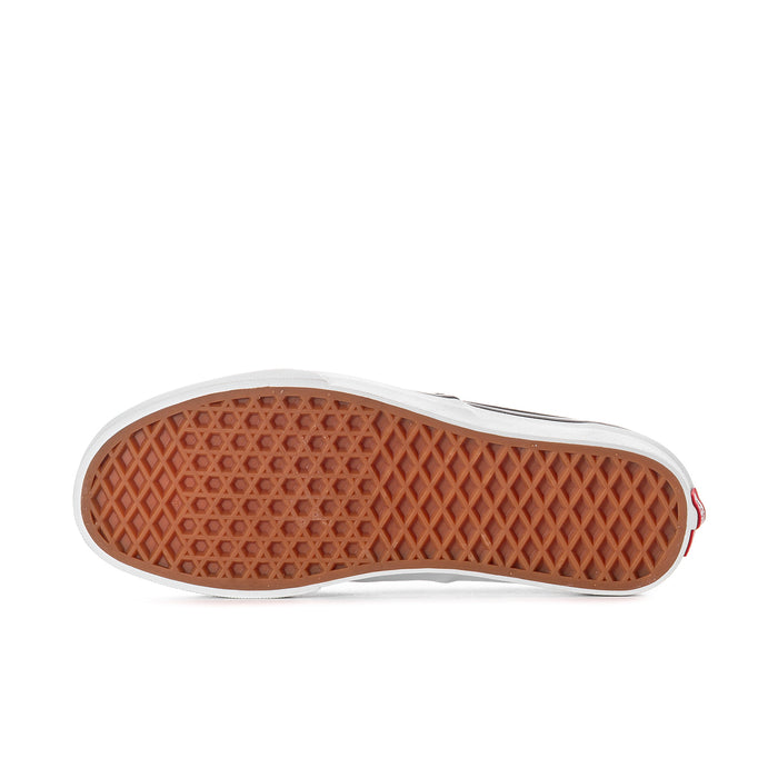 Women's black low-top sneakers outsole with textured gum rubber tread.